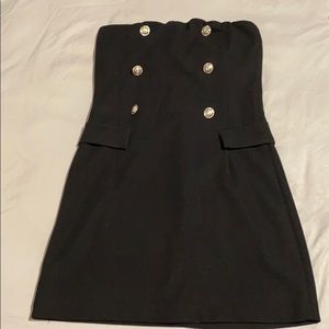 Black strapless mini dress, zipper in the back.